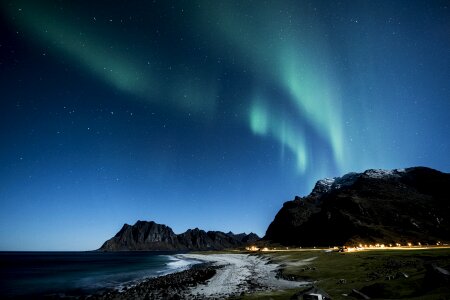 Aurora Borealis (Northern Lights) above coastal sea photo