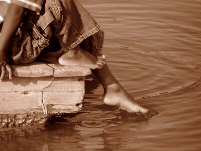 Child boy playing in water