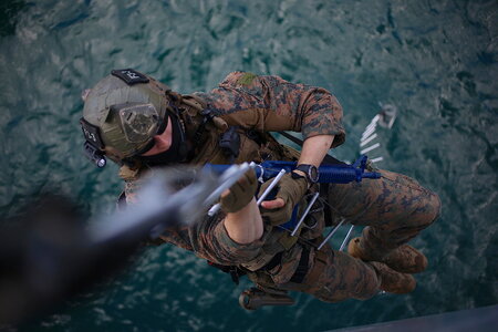 A U.S. Marine climbs an insertion ladder