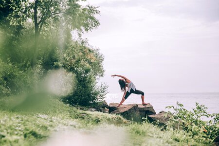 Yoga Poses On Seaside Rocks photo