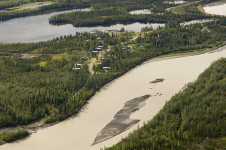 Aerial shot of river winding through forest and around village in Tetlin National Wildlife Refuge photo