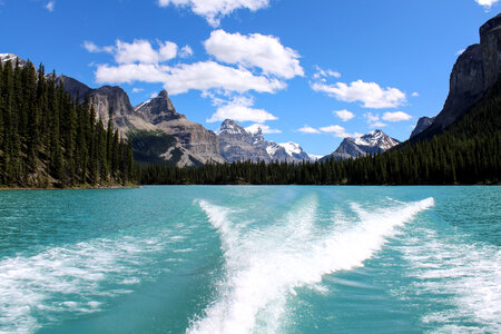 Mountain and lake landscape behind the boat in Jasper National Park, Alberta, Canada photo
