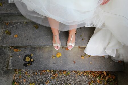 Bride Standing on Stairs Closeup of Legs photo