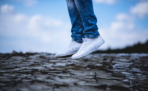 Person in White Sneakers Jumping photo