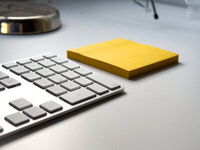 Desk with Keyboard and Notepad