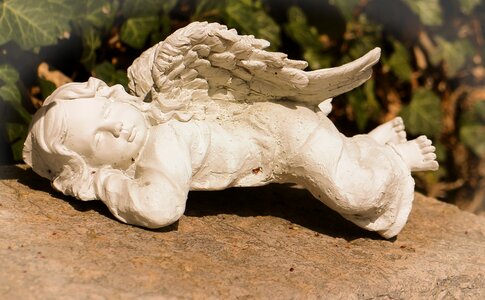 Sleeping dreaming stone figure photo