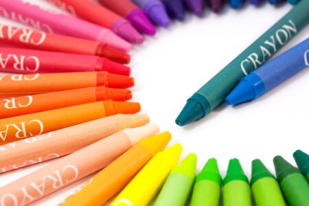 Colorful Crayons in a Slanted Row on white background photo