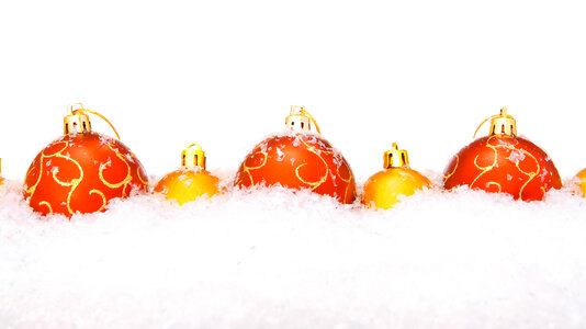Red and Golden Christmas Balls in Snow photo
