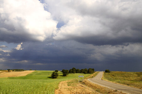 Heavy Clouds over the roads and landscape photo