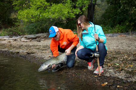 Young couple releases a Fall Salmon