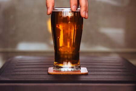 Man Holding Beer Glass photo