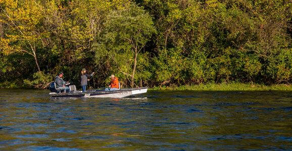 Group fishing from boat on White River photo