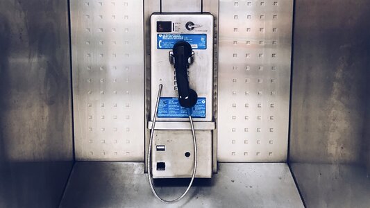 Metal Urban Public Phone Booth with Black Handset photo