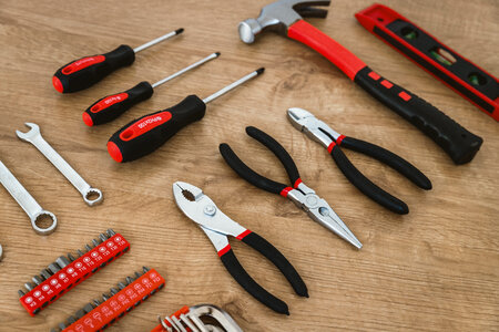 2 Construction tools on the wooden background. photo