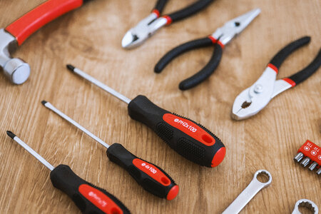 3 Construction tools on the wooden background. photo