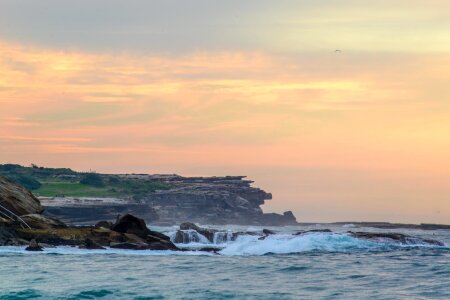 Ocean rocks sunrise photo