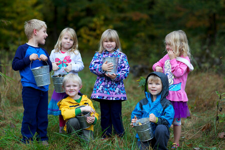 Children collect acorns photo