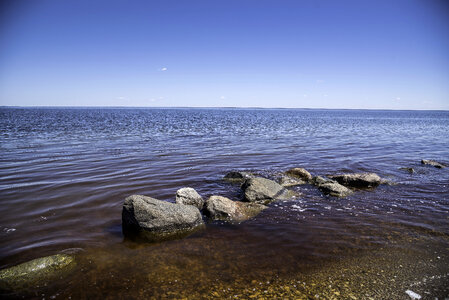 Rocks in the shallow water at Lake Winnipeg photo