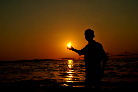 Man Holding Sun photo