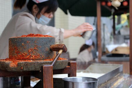 Traditional stone chili powder manual photo