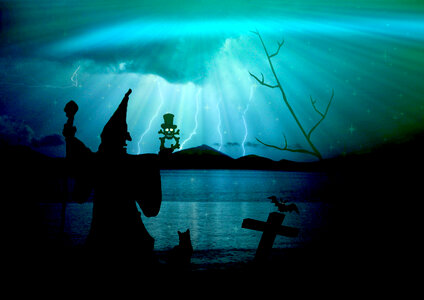 Creepy Witch in fantasy blue landscape with lightning photo