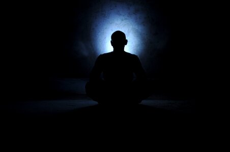 Meditating aura back light photo