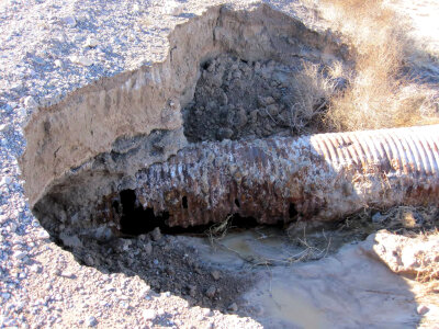 Part of a road was washed out due to flooding in the Ash Meadows National Wildlife Refuge photo