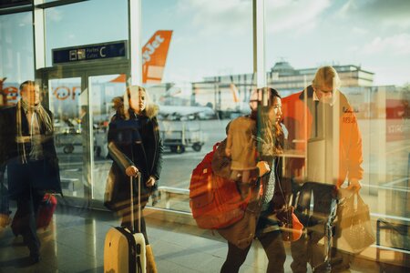 People Walking Through an Airport photo