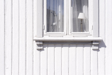 White Wall of an Old Wooden House with Window photo