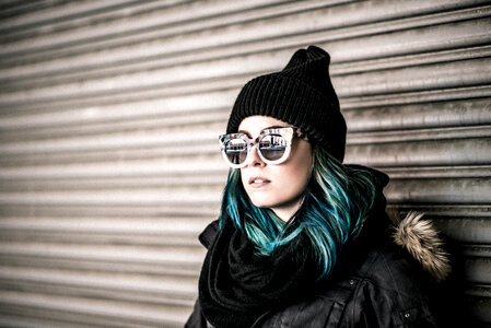 Girl with Blue Hair Wearing Hat and Sunglasses photo