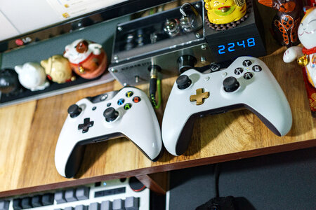 Console game controllers on the table photo