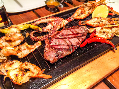 Barbeque with steak, shrimp, red peppers, and Octopus photo