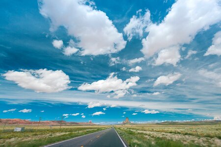 Asphalt azure sky clouds