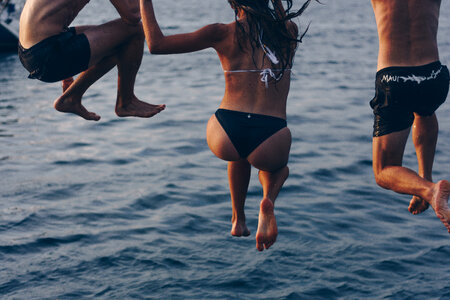 Young People Jumping into the Water photo