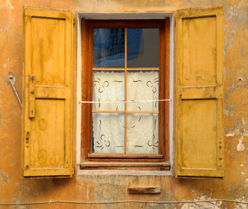 Old Window with Yellow Shutters photo