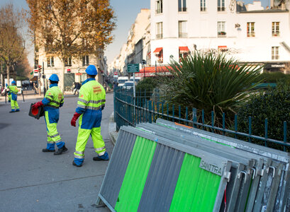 Municipal Workers Preparing Barriers and Bollards photo