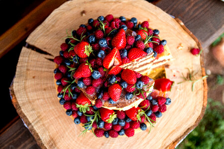 Amazing fruit cake with strawberries, blueberries and raspberries photo