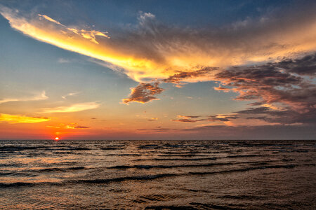 Sunset over the sea and beautiful cloudscape photo