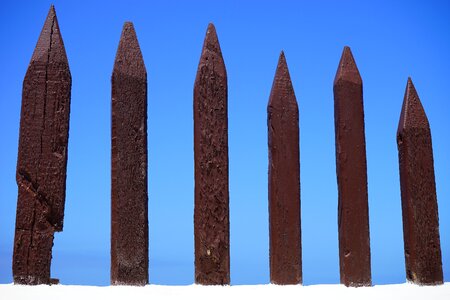 Demarcation wood pole fence