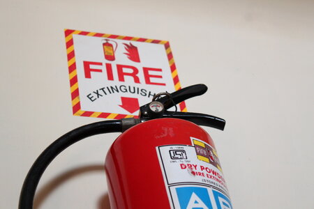 Fire Red Colored Cylinder Extinguisher photo