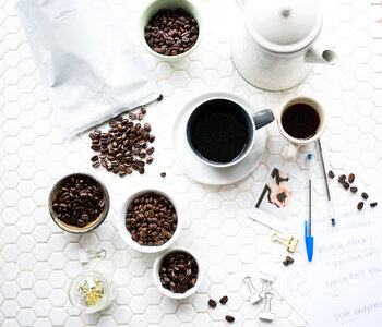 Coffee Beans on Tiled White Table photo