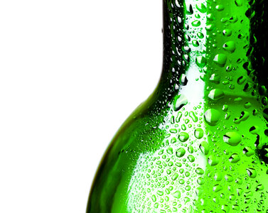 Glass bottle with water drops photo
