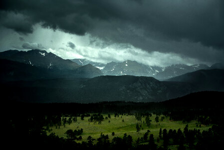 Mountain and forest landscape in Colorado under stormy skies photo