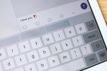3 Valentine’s Day, Detail of screen of tablet with a message “I love you” photo