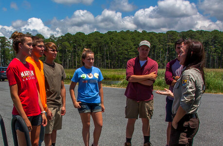 FWS staff talks to group of high school students at kiosk-1