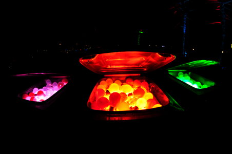 Glowing balls in trashcans