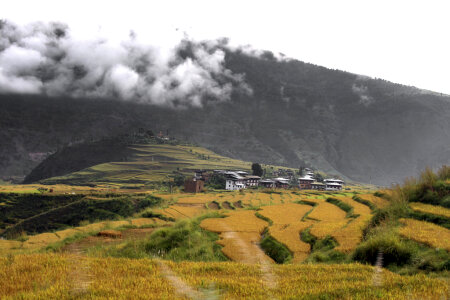 Mountainous landscape with clouds with house and terraces