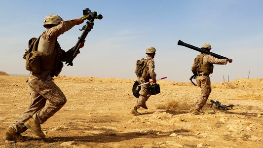 Three US Marines on the battlefield photo