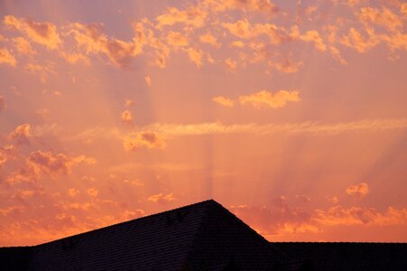 Sunset roofs clouds photo