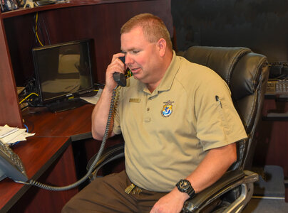 FWS Staffer talks on telephone
